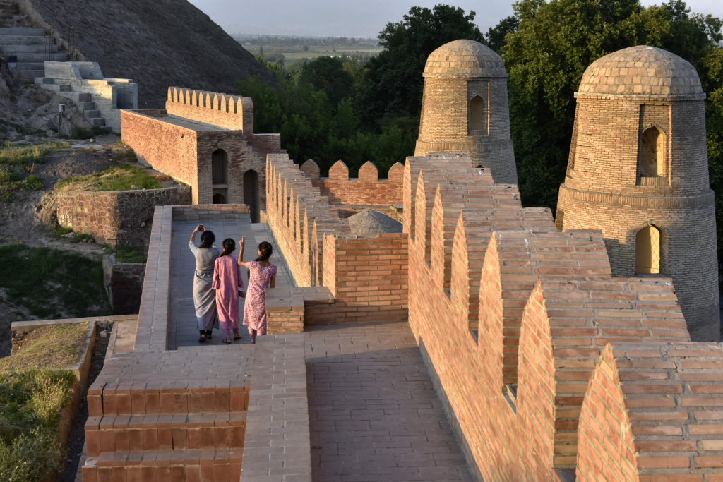 Visitors take photos at the Hisor Fortress in Tajikistan. /CFP