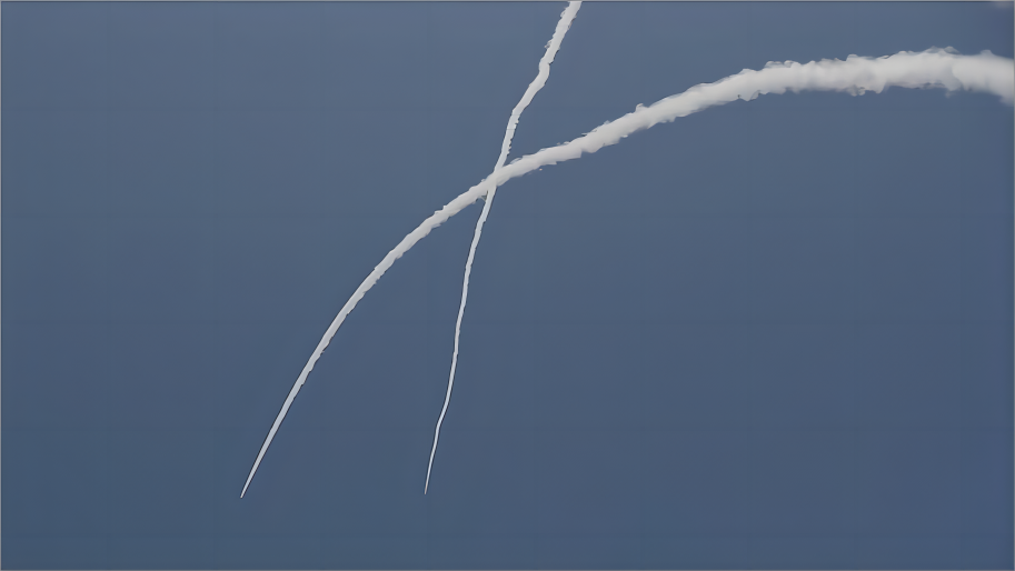 Streaks of smoke are seen as Israel's Iron Dome defense system intercepts rockets fired from the Gaza Strip, in Sderot, southern Israel, May 10, 2023. /Xinhua