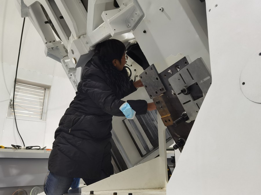 Wang Dongguang, chief engineer of CAS's Huairou Solar Observing Station of National Astronomical Observatories, works inside a dome of the Lenghu observatory site in northwest China's Qinghai Province, April 8, 2023. /Xinhua
