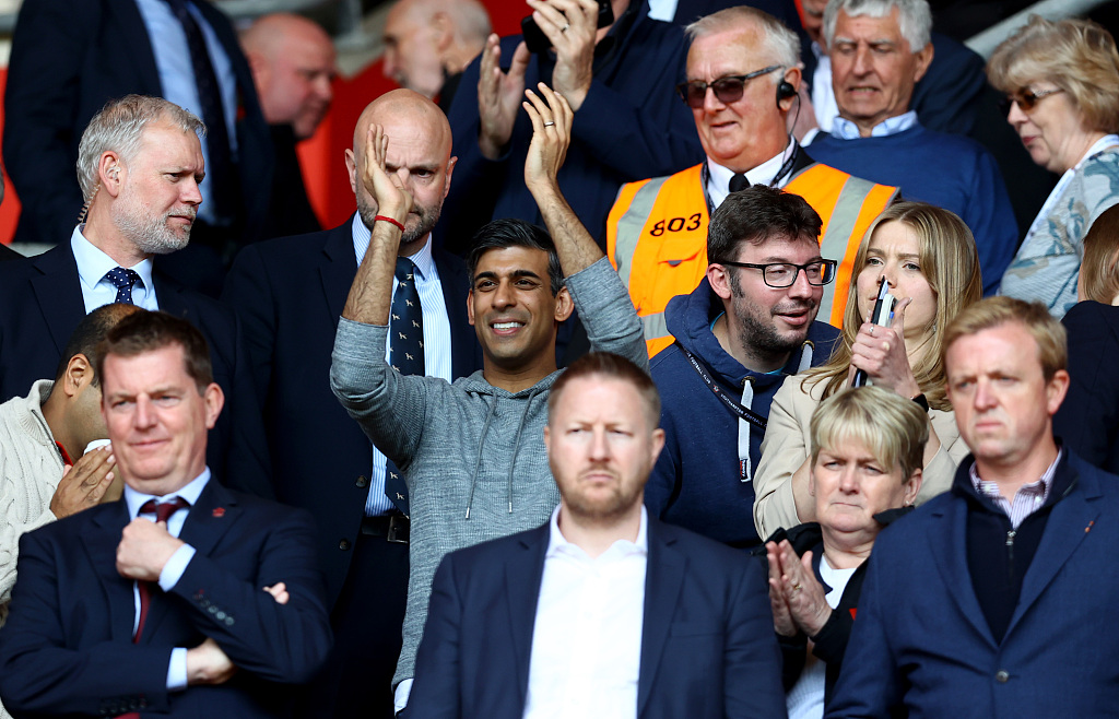 British Prime Minister Rishi Sunak (C) pictured in the home crowd during the Premier League match between Southampton and Fulham at St. Mary's Stadium in Southampton, England, May 13, 2023. /CFP