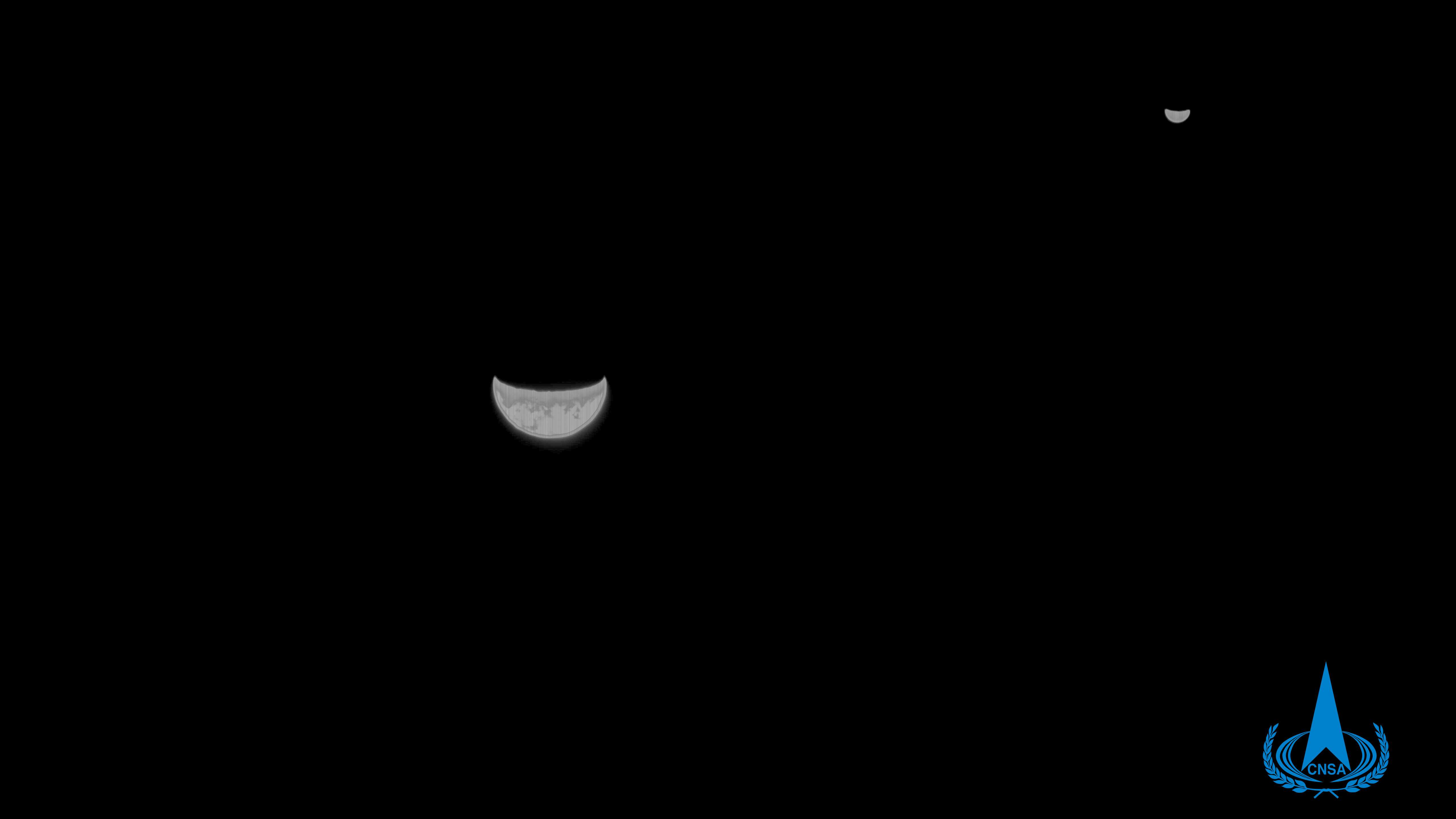 A photo of Earth and moon captured by China's Tianwen-1 probe at a distance of 1.2 million kilometers away. /China National Space Agency
