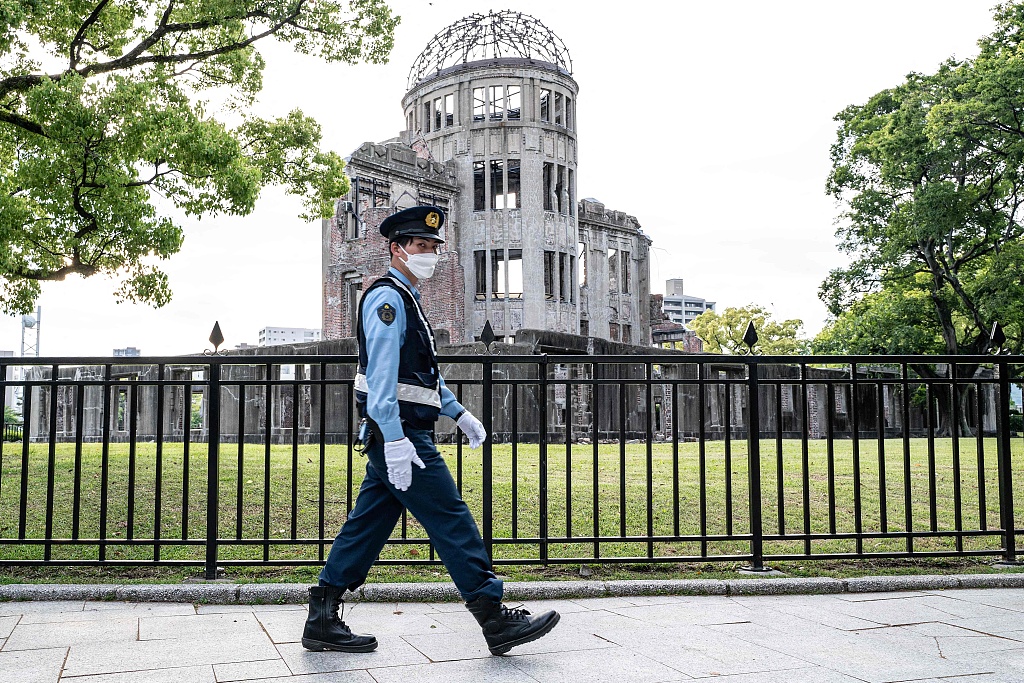 A policeman patrols past the Atomic Bomb Dome in Hiroshima, Japan, May 14, 2023, just days ahead of the arrival of leaders for the G7 Leaders' Summit. /CFP