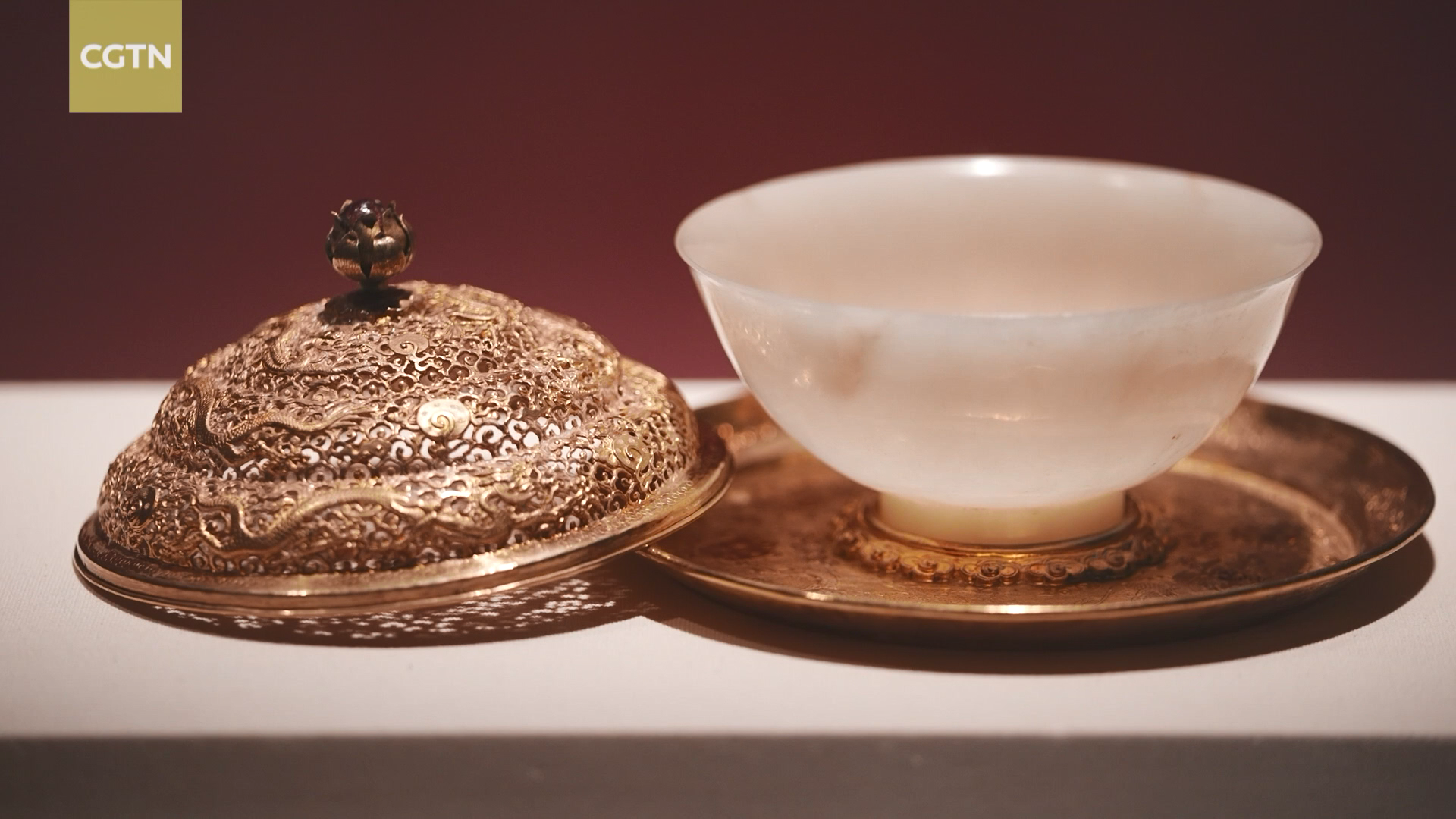 A jade bowl with a gold tray and lid is on display at the exhibition of the royal treasures of Emperor Wanli of the Ming Dynasty (1368 -1644) at the National Museum of Classic Books. /CGTN