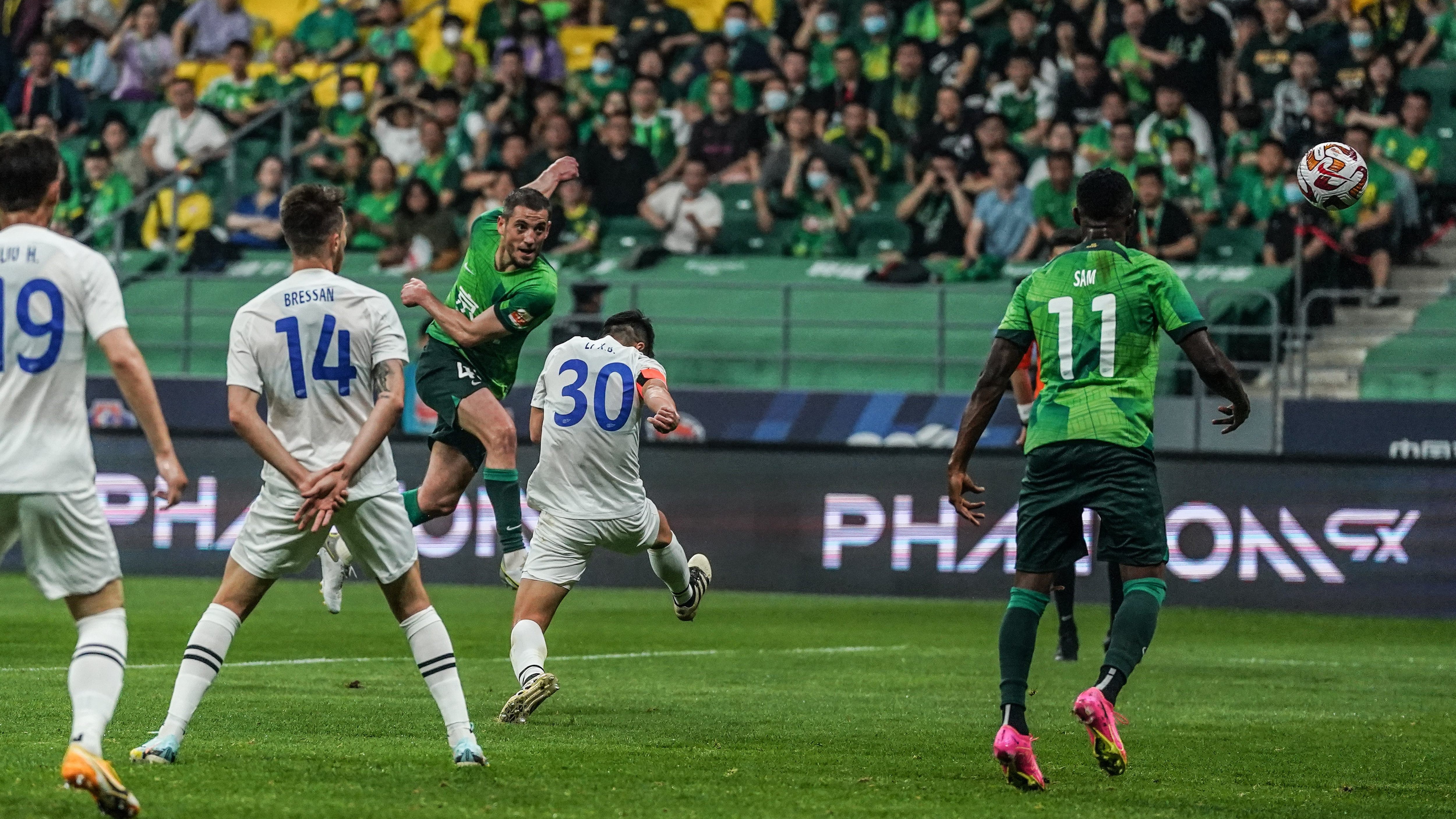Beijing Guoan's Arijan Ademi unleashes a match-winning shot during their Chinese Super League clash with Nantong Zhiyun at the new Workers' Stadium in Beijing, China, May 15, 2023. /Beijing Guoan