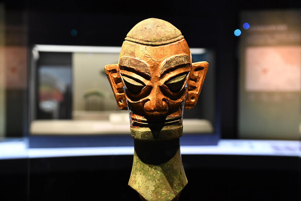 A bronze sculpture of a human head with a gold mask unearthed at the Sanxingdui Ruins site exhibited at the Anhui Museum in east China’s Anhui Province, April 19, 2023. /CFP