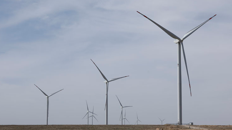 Wind turbines are seen at central Asia's largest wind farm built by a Chinese firm near the city of Zhanatas in the Zhambyl Region, Kazakhstan, May 24, 2021. /Xinhua