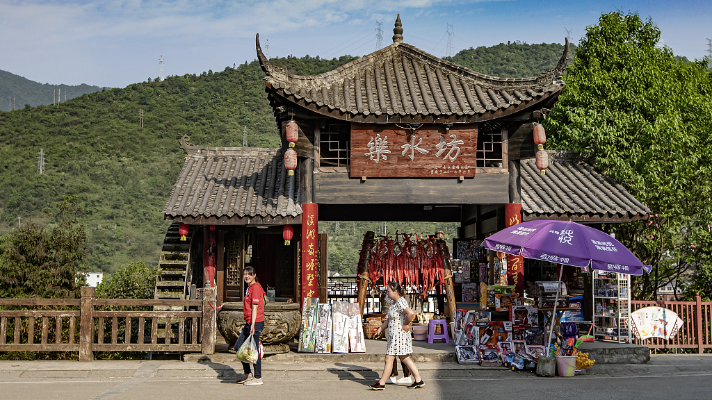 Tourists visit the old street of Shuimo Ancient Town in Wenchuan County, Sichuan on May 3, 2020. /CFP
