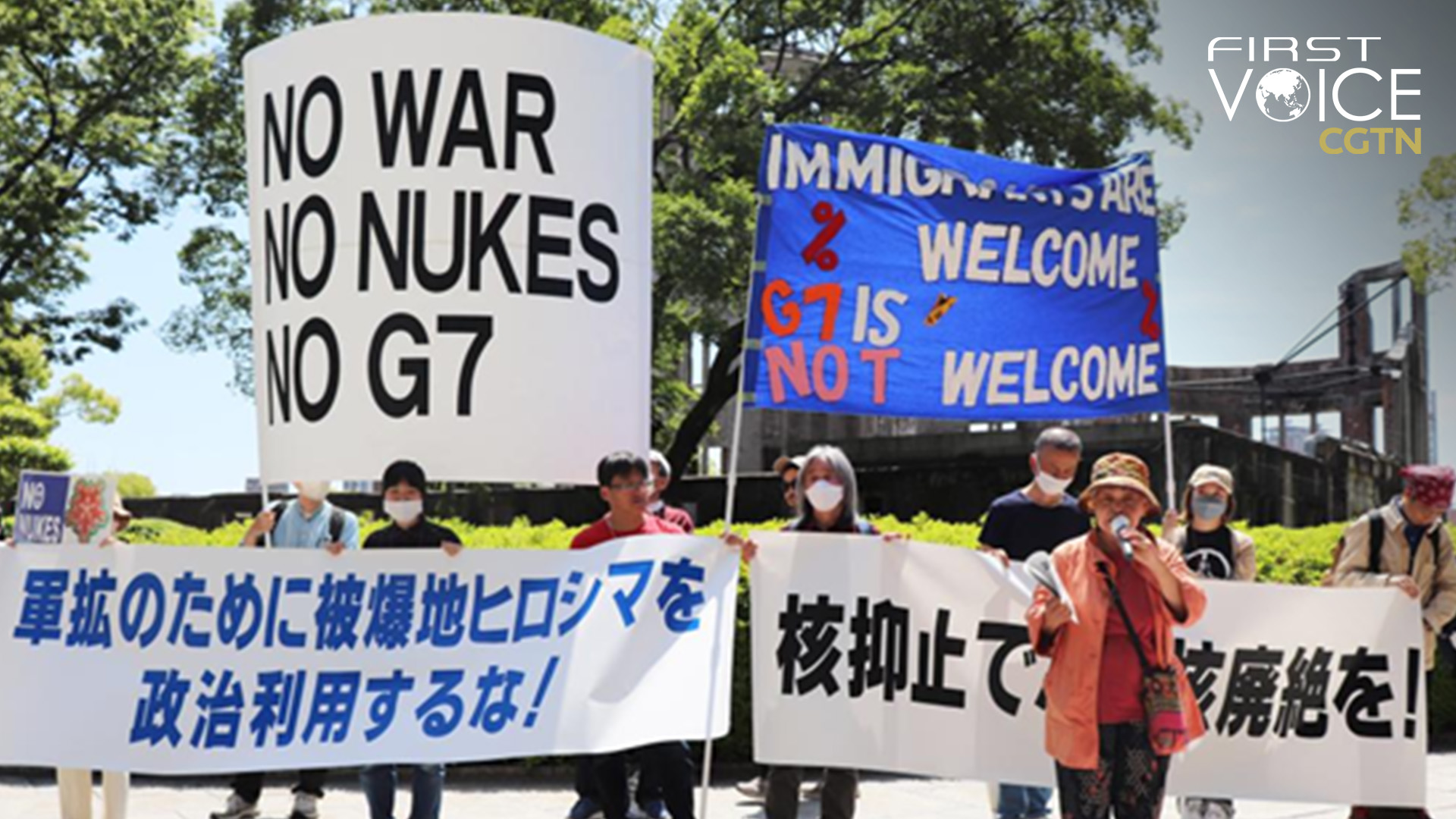 People holding banners protest against the Group of Seven (G7) summit at the site of the atomic bombing near the Peace Memorial Park in Hiroshima, Japan, May 14, 2023. /Xinhua