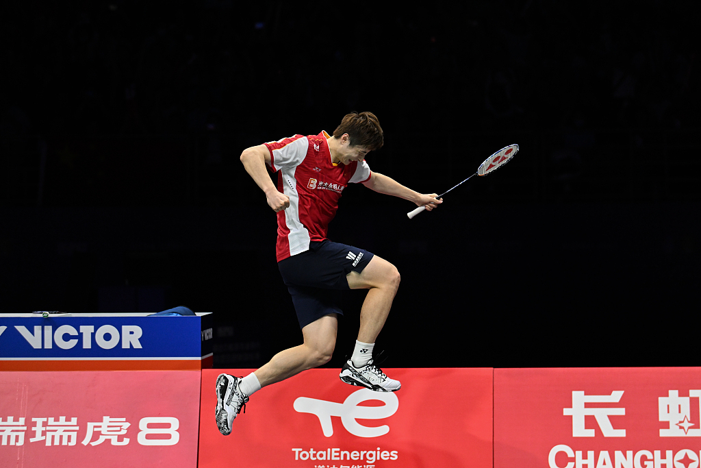 Shi Yuqi of China jumps to celebrate his victory during the Sudirman Cup semifinal men's singles match in Suzhou, China, May 20, 2023. /CFP