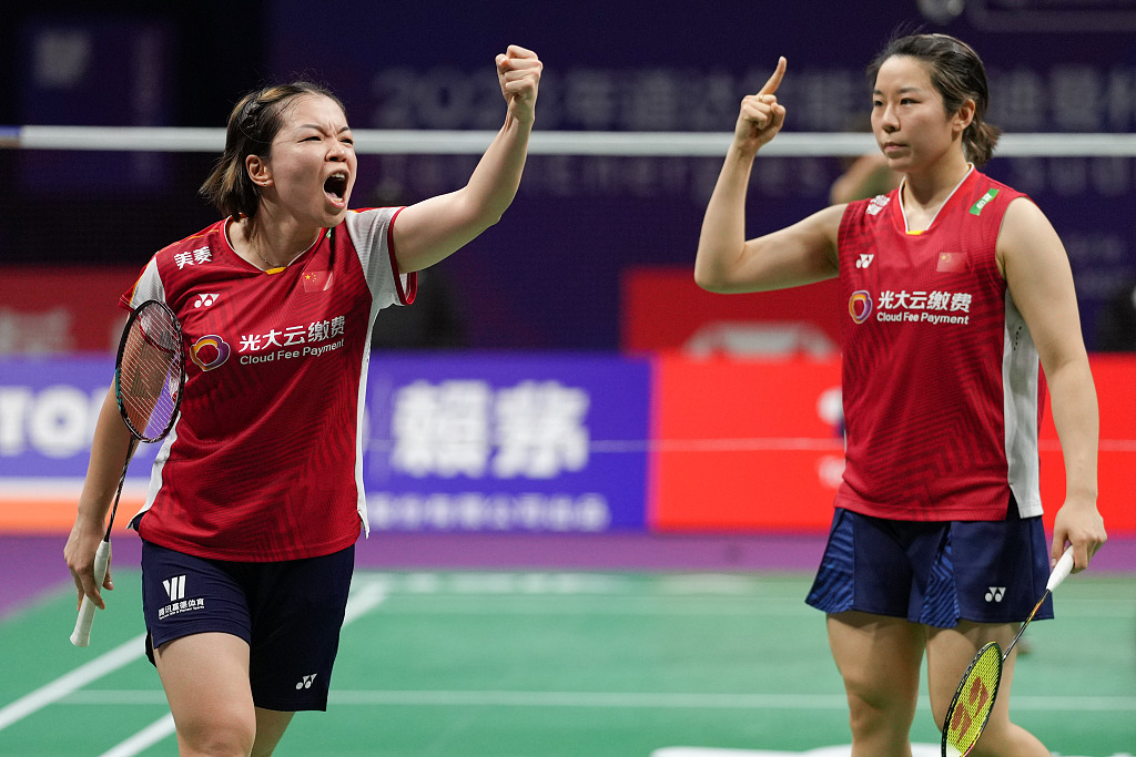 China's Chen Qingchen (L) and Jia Yifan celebrate their victory during the Sudirman Cup semifinal women's doubles match in Suzhou, China, May 20, 2023. /CFP