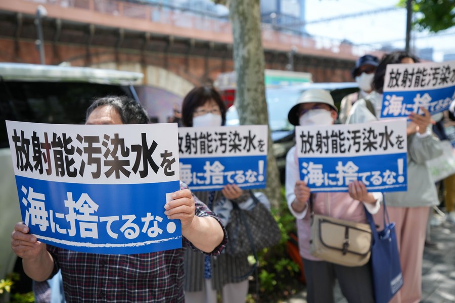 People rally in front of Tokyo Electric Power Company (TEPCO) headquarters to protest against the Japanese government's plan to discharge nuclear wastewater into the sea in Tokyo, Japan, May 16, 2023. /Xinhua