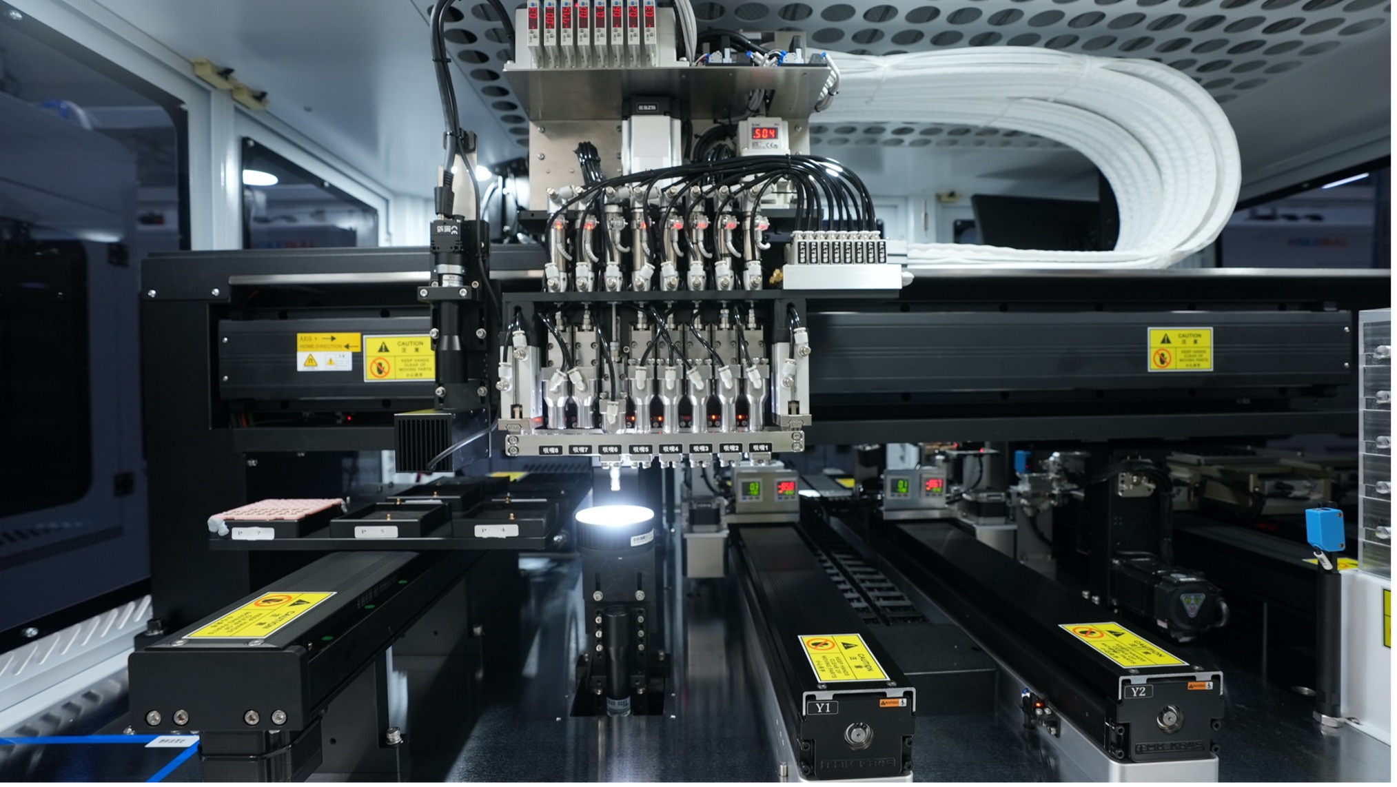 Manufacture machine on the production line of Ningbo Novel Optical in east China's Zhejiang Province, May 18, 2023. /CGTN