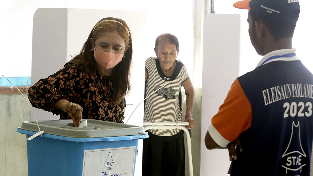 A woman casts her ballot at a polling station during the parliamentary election in Dili, Timor-Leste, May 21, 2023. /CFP