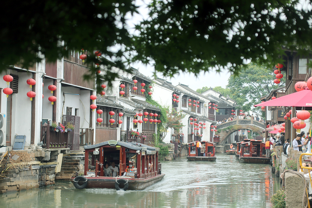 The photo, taken on May 21, shows tourist boats travel through the river that is situated in the ancient Shantang Street in the eastern Chinese city of Suzhou, Jiangsu Province. /CFP