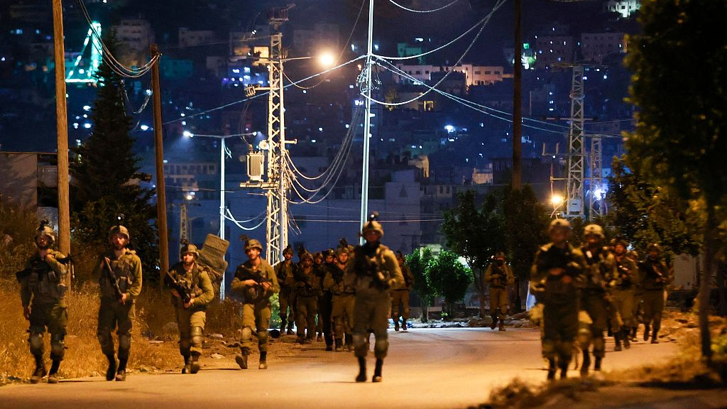 Israeli soldiers leave after a raid at the Balata refugee camp in the occupied West Bank city of Nablus early, May 22, 2023. /CFP