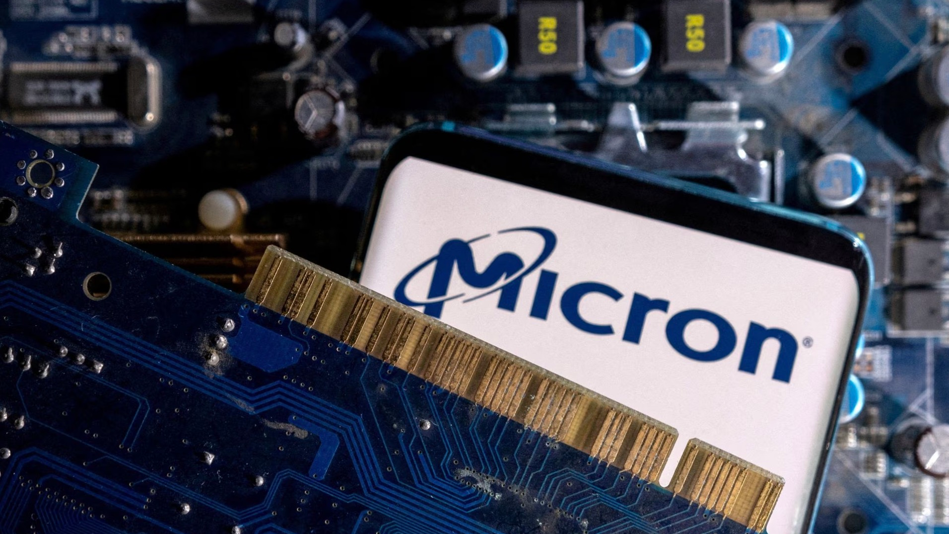 A Micron logo displayed on a computer motherboard, March 6, 2023. /Reuters