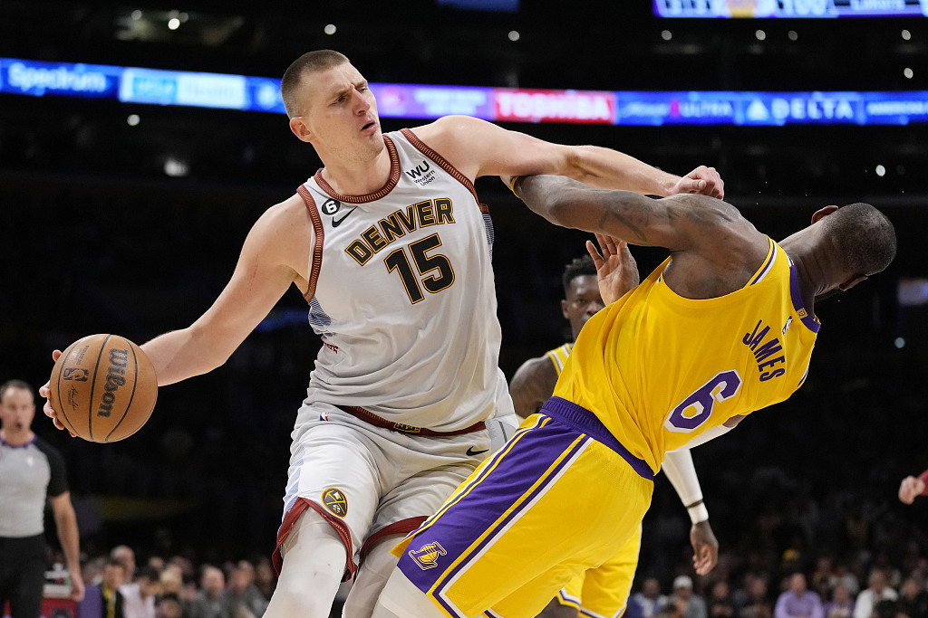 Denver Nuggets center Nikola Jokic (15) collides with Los Angeles Lakers forward LeBron James (6) in the second half of Game 4 of the NBA Western Conference Final series in Los Angeles, U.S., May 22, 2023. /CFP
