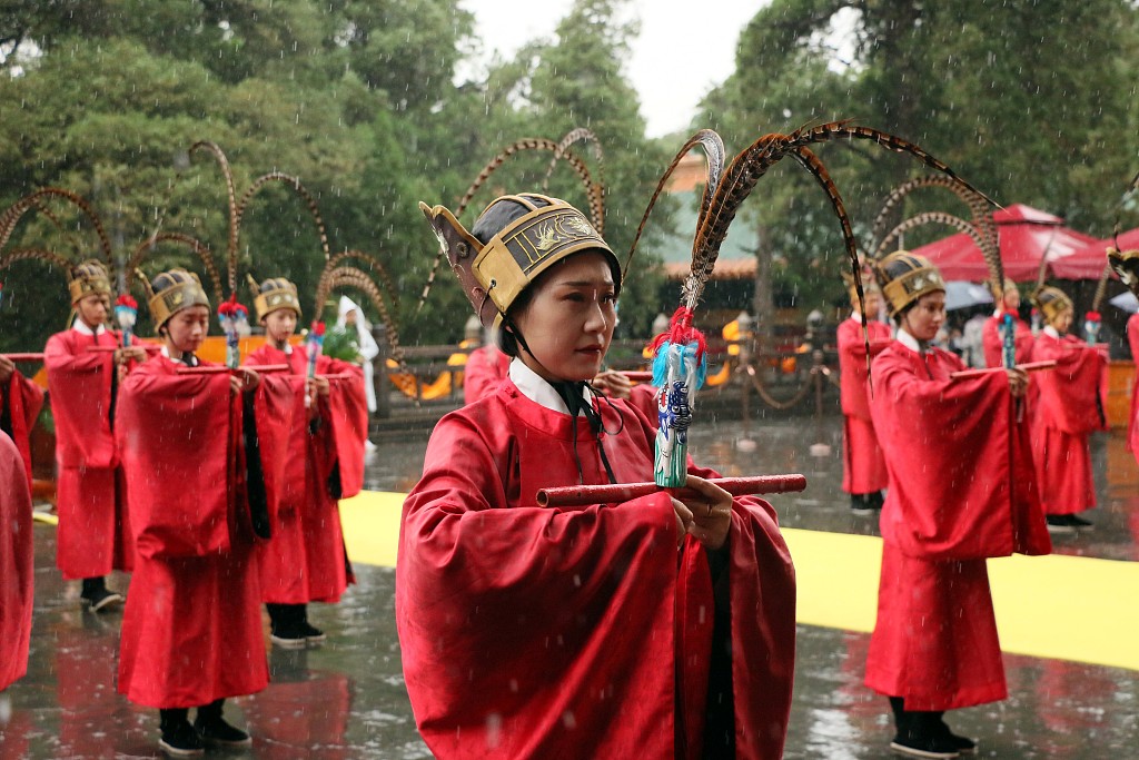 A ceremony is held in front of the temple to show respect for knowledge and ancient wisdom in Qufu, Shandong Province, May 21, 2023. /CFP
