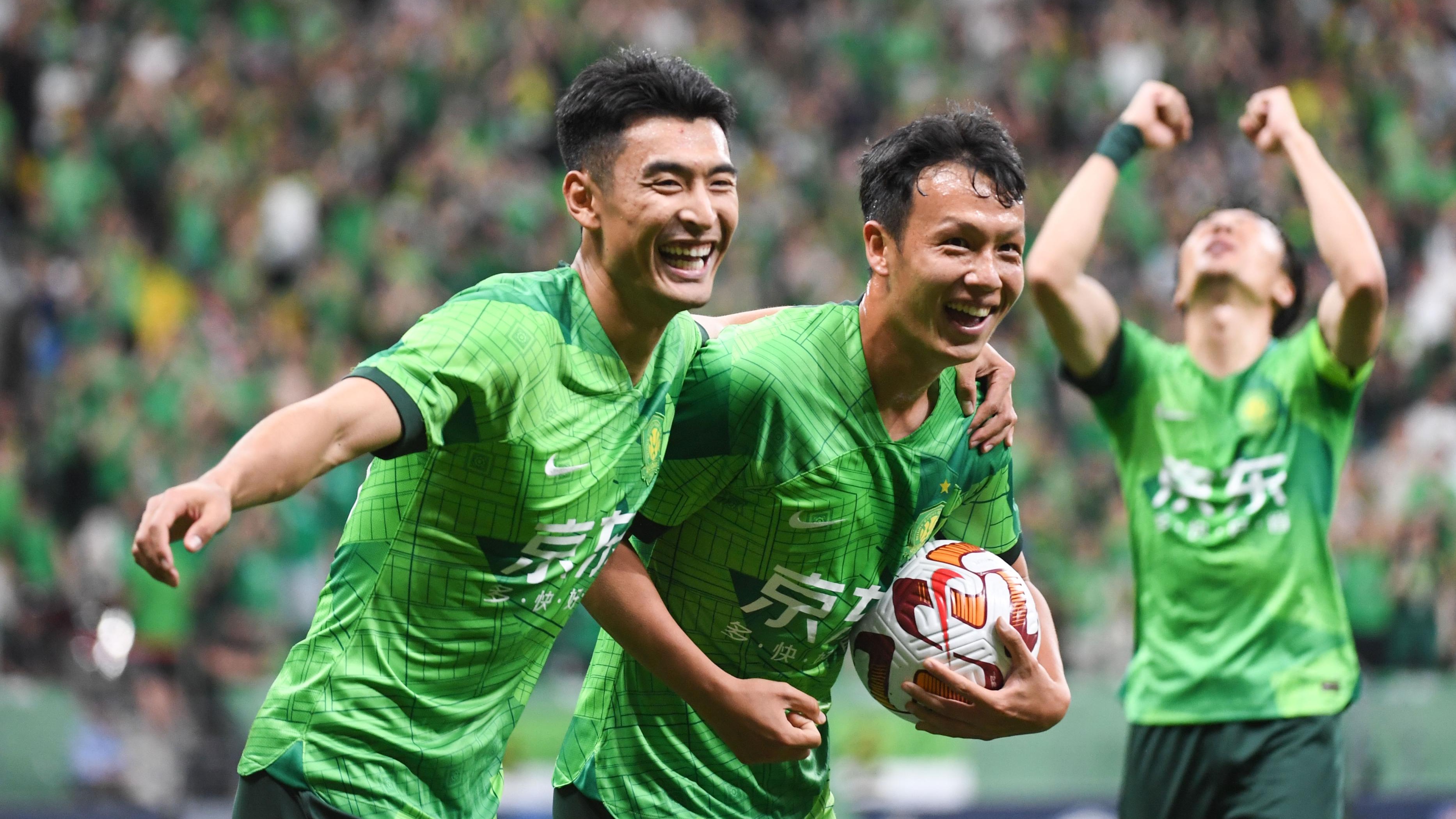 Beijing Guoan's Wang Ziming (L) and Gao Tianyi celebrate during their Chinese Super League clash with Cangzhou Mighty Lions at the new Workers' Stadium in Beijing, China, May 23, 2023. /Beijing Guoan