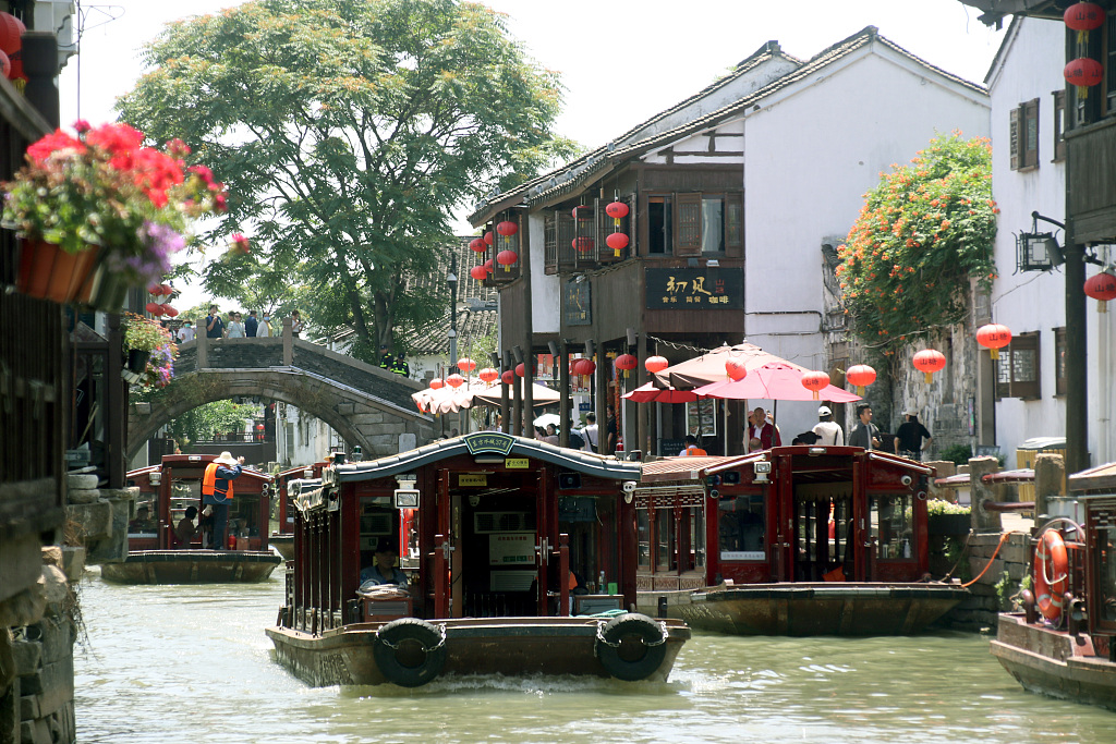 Tourists take a boat tour of Shantang Street in the ancient city of Suzhou, east China’s Jiangsu Province, May 23, 2023. /CFP