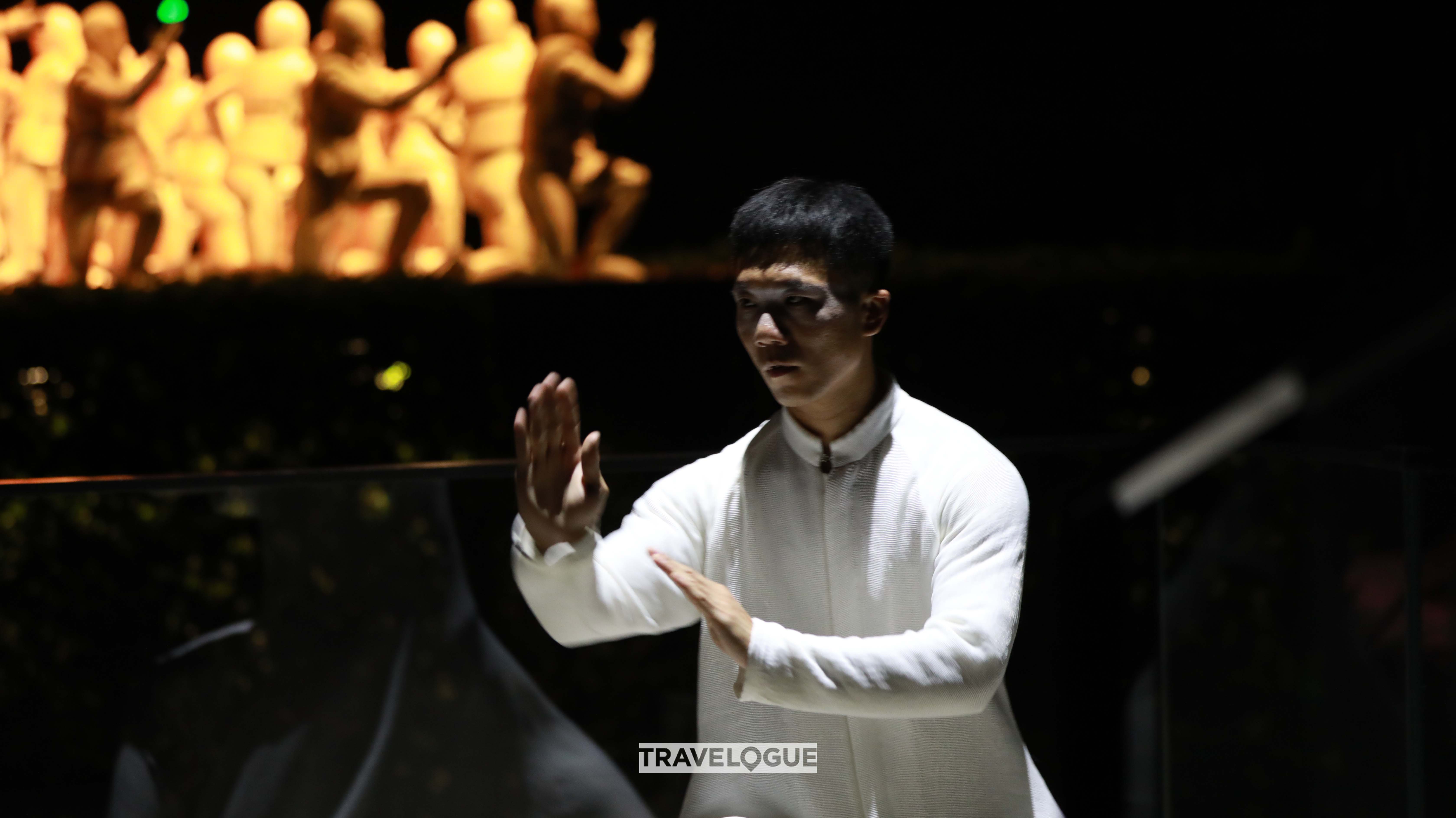 The undated photo shows a tai chi show titled 