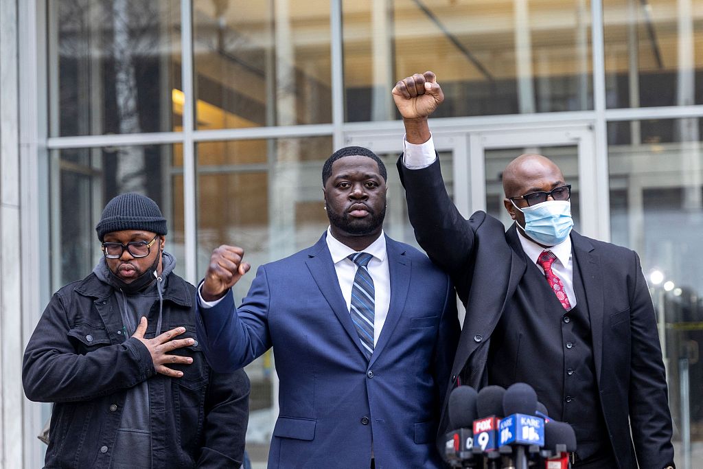 Philonise Floyd (R) and Terrence Floyd (L) George Floyd's brothers, and nephew Brandon Williams (C) attend a press conference outside the US District Court in St Paul, Minnesota on December 15, 2021. Derek Chauvin, the white former Minneapolis police officer convicted of murdering African-American George Floyd, pleaded guilty to federal civil rights violations charges in the crime, local media reported. /CFP