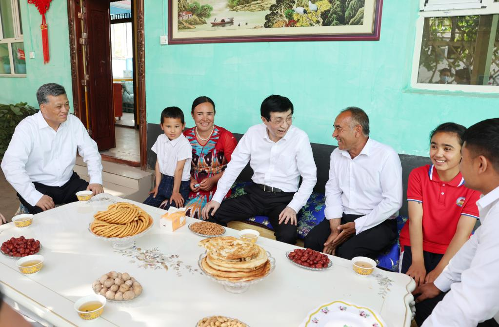 Wang Huning, a member of the Standing Committee of the Political Bureau of the Communist Party of China (CPC) Central Committee and chairman of the National Committee of the Chinese People's Political Consultative Conference, visits a Uygur family in Kashgar, northwest China's Xinjiang Uygur Autonomous Region, May 22, 2023. /Xinhua