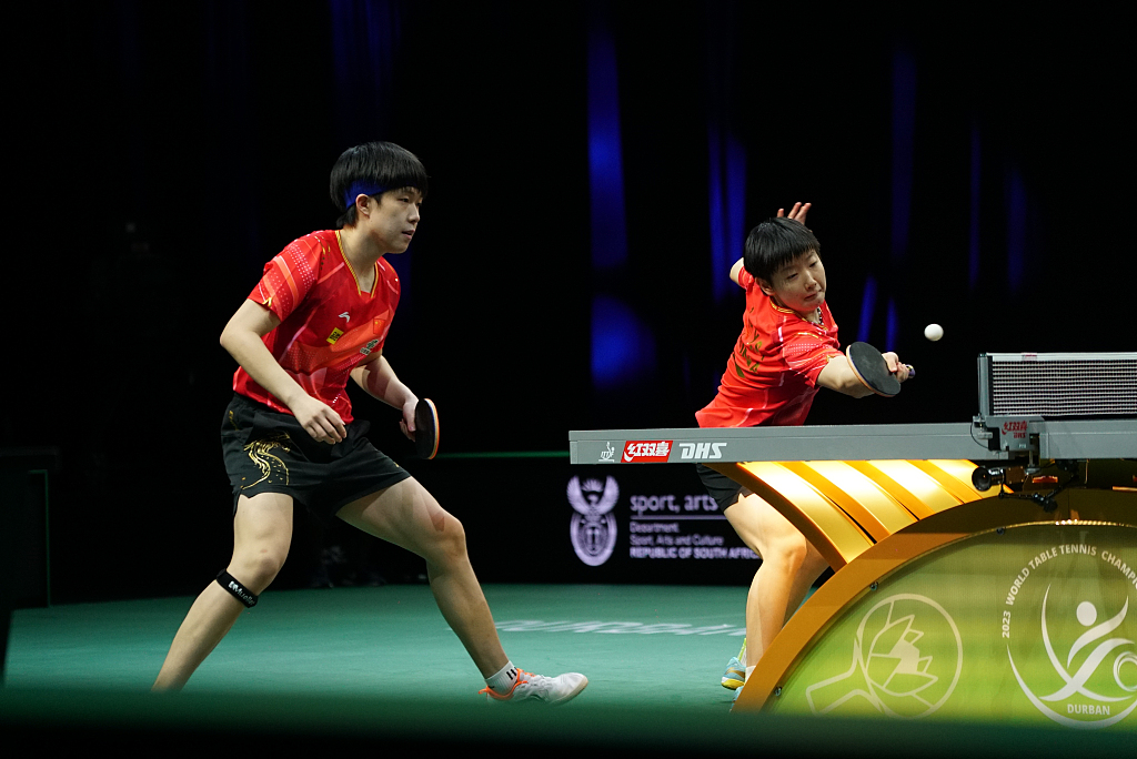 Wang Chuqin (L) and Sun Yingsha of China compete during the mixed doubles quarterfinals at the ITTF World Table Tennis Championships Finals in Durban, South Africa, May 24, 2023. /CFP