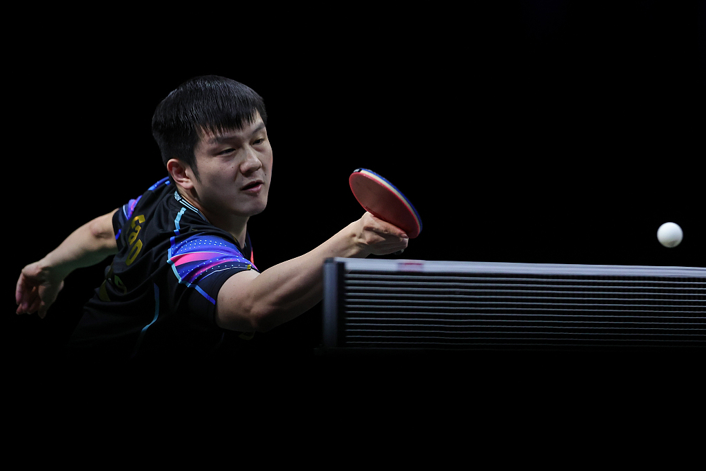 Fan Zhendong of China competes in the men's singles third round game at the ITTF World Table Tennis Championships Finals in Durban, South Africa, May 24, 2023. /CFP