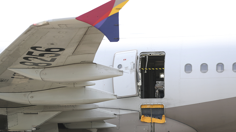 An Asiana Airlines plane is parked as one of the plane's doors suddenly opened at Daegu International Airport in Daegu, South Korea, May 26, 2023. /CFP
