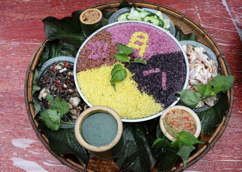 Beyond the color black, Wufan Festival offers a feast of colors. Dong people hold a banquet with black rice in Pingliu Village of Liuzhou, south China's Guangxi Zhuang Autonomous Region to celebrate Wufan Festival. /CFP