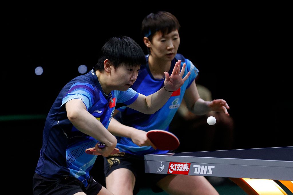 Sun Yingsha(L) and Wang Manyu of China play during the women's doubles semifinals at the Table Tennis World Championships Finals in Durban, South Africa, May 26, 2023. /CFP