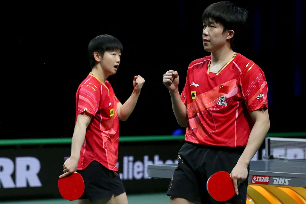 Sun Yingsha (L) and Wang Chuqin of China react after winning a point in the International Table Tennis Federation World Table Tennis Championships Finals mixed doubles final against Tomokazu Harimoto and Hina Hayata of Japan in Durban, South Africa, May 26, 2023. /CFP