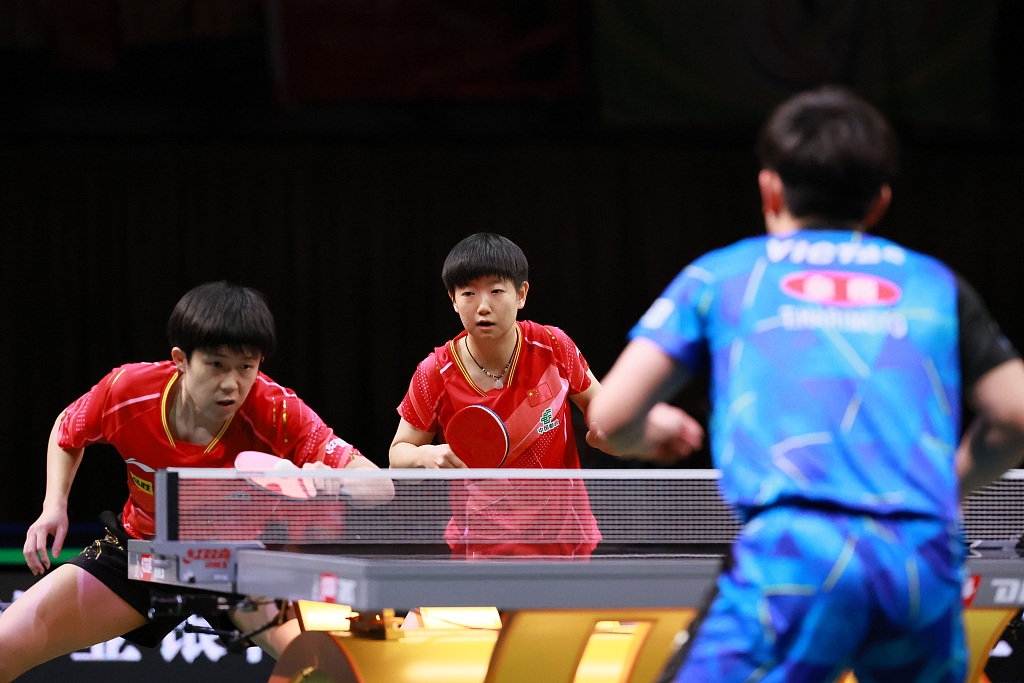 Wang Chuqin (L) and Sun Yingsha (C) of China compete in the International Table Tennis Federation World Table Tennis Championships Finals mixed doubles final against Tomokazu Harimoto and Hina Hayata of Japan in Durban, South Africa, May 26, 2023. /CFP