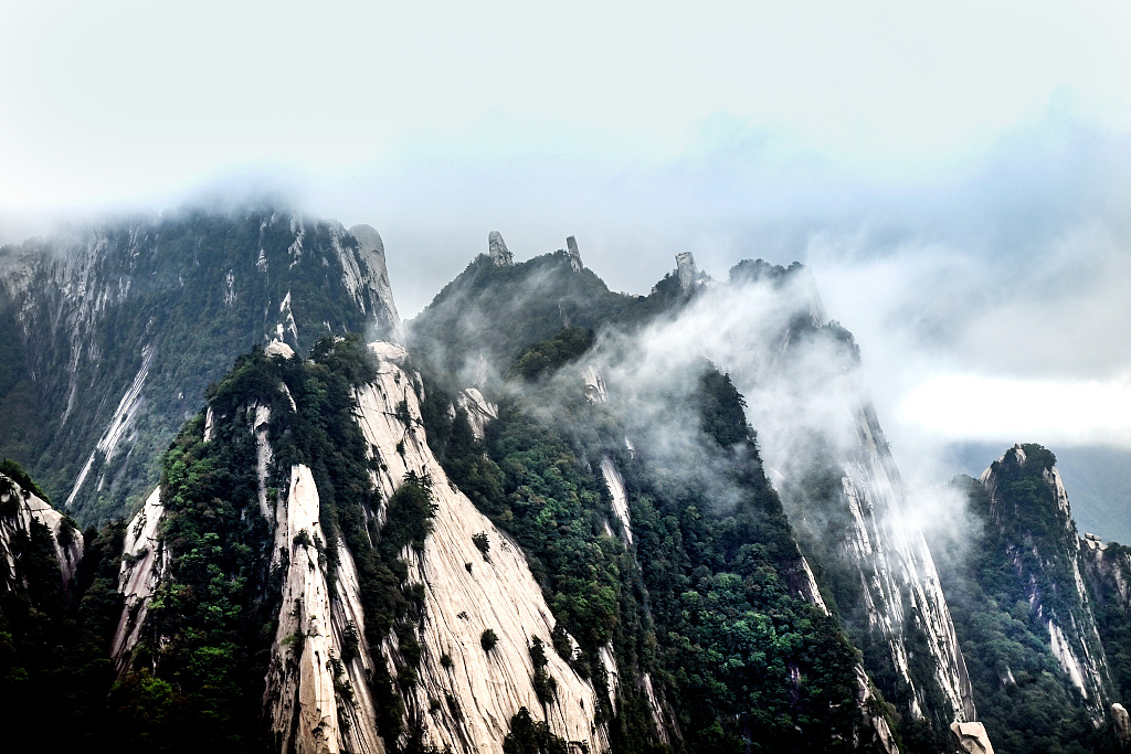 The magnificent Huashan Mountain in northwest China's Shaanxi Province is shrouded in mist and clouds on May 26, 2023. /CFP