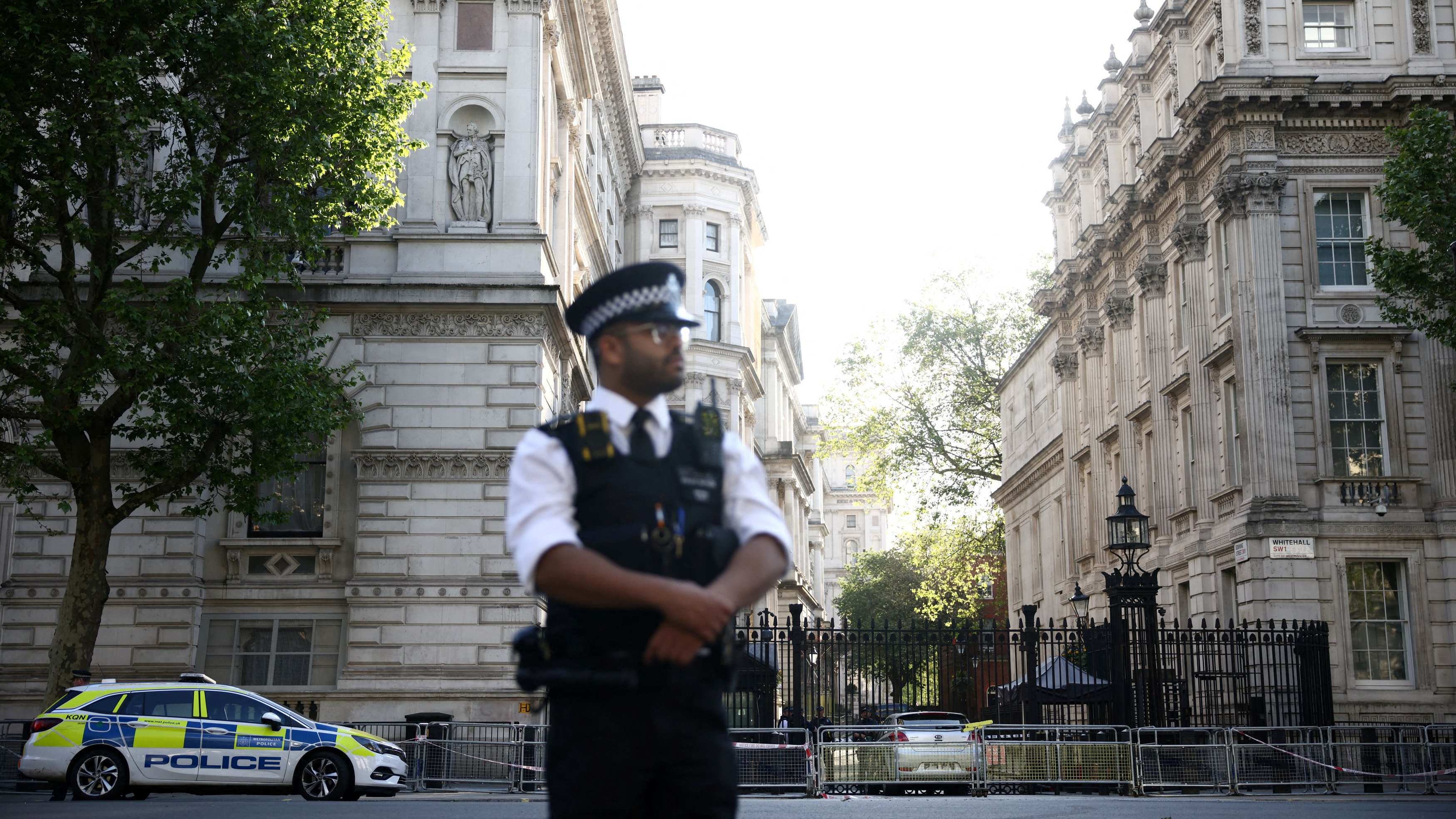 A police officer stands on guard near the site where a car crashed into the front gates of Downing Street in London, Britain, May 25, 2023. /Reuters