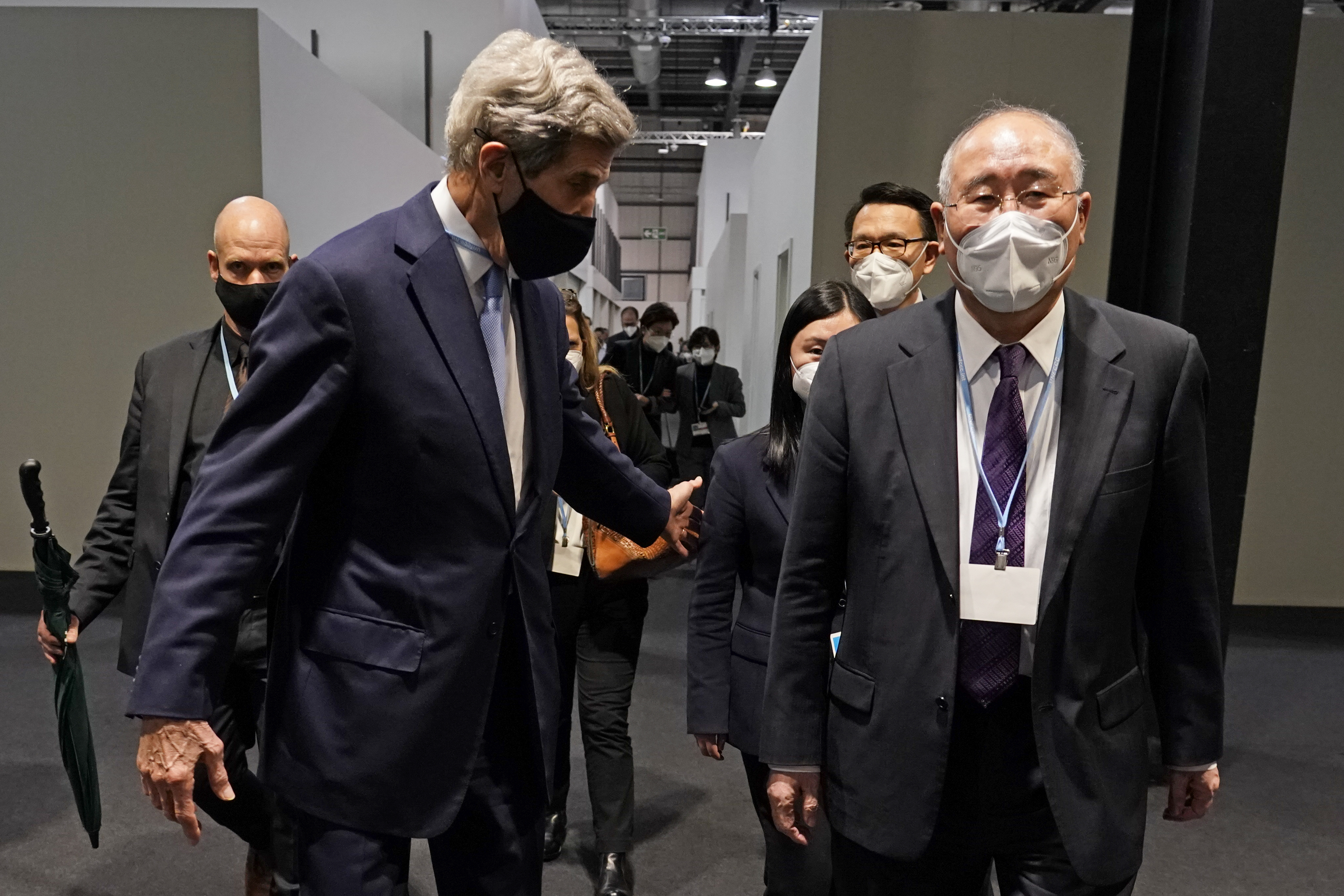China's special envoy for climate change Xie Zhenhua, right, walks with John Kerry, United States Special Presidential Envoy for Climate at the COP26 U.N. Climate Summit in Glasgow, Scotland, Nov. 12, 2021. /AP