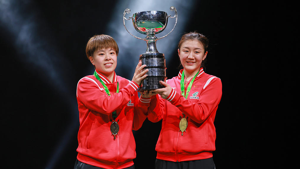 Wang Yidi (L) and Chen Meng celebrate winning the women's doubles title at the ITTF World Table Tennis Championships Finals in Durban, South Africa, May 27, 2023. /CFP