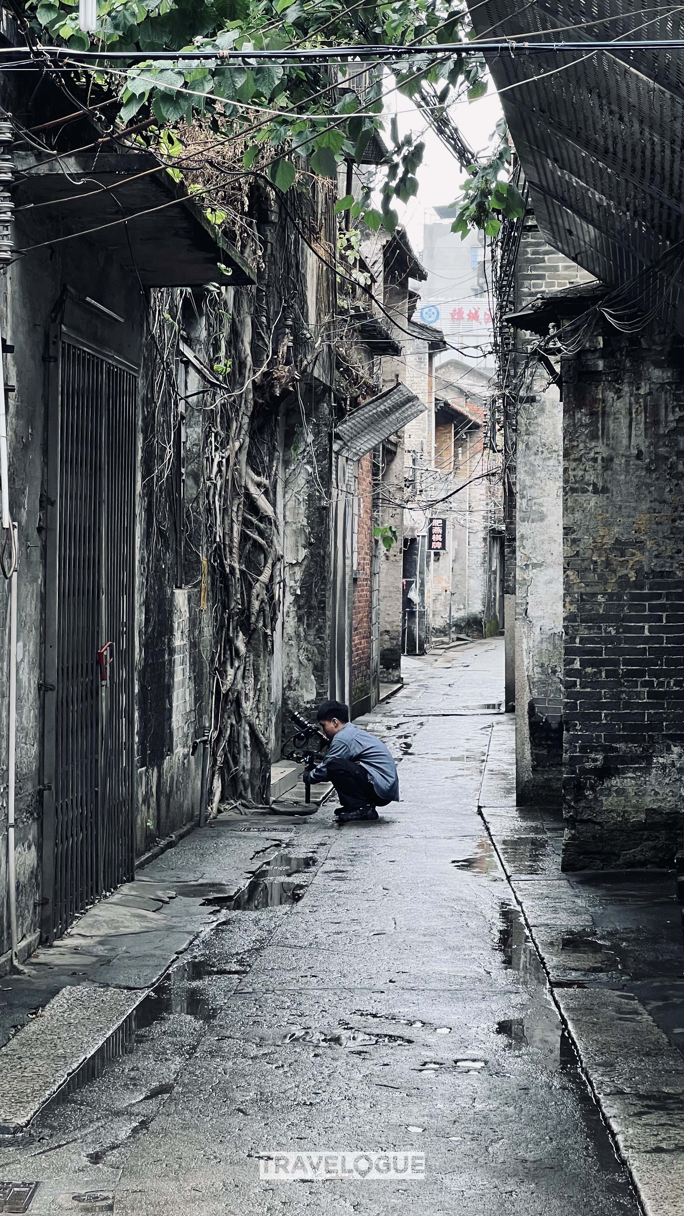 An undated photo shows a tourist sightseeing around the old streets of Foshan, Guangdong Province. /CGTN