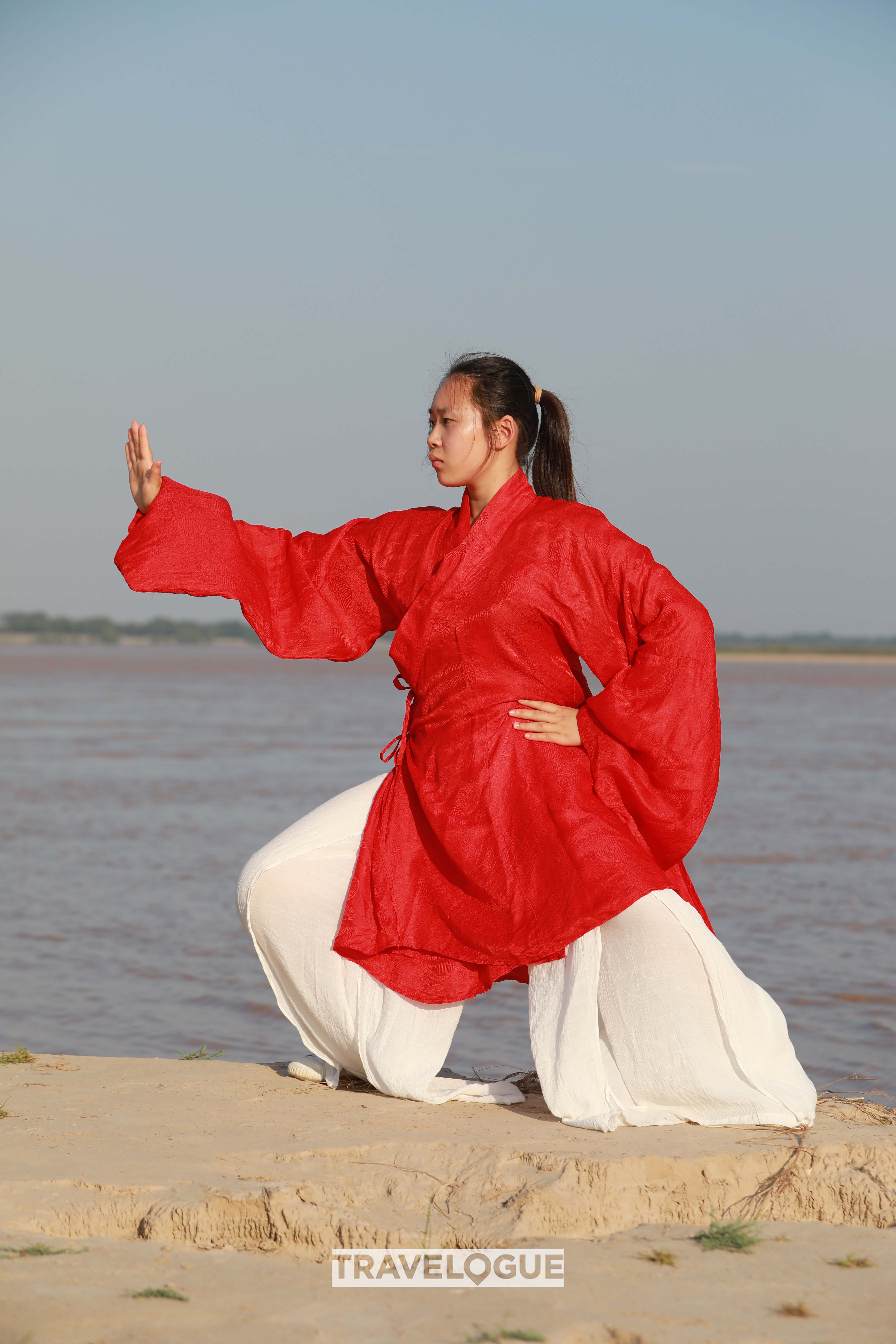 A woman practices Tai Chi in Chenjiagou, central China's Henan Province. /CGTN 