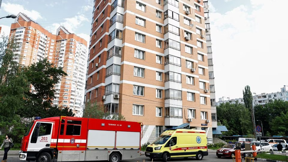 An ambulance and a fire truck parked outside a multi-story apartment block following a drone attack in Moscow, Russia, May 30, 2023. /Reuters