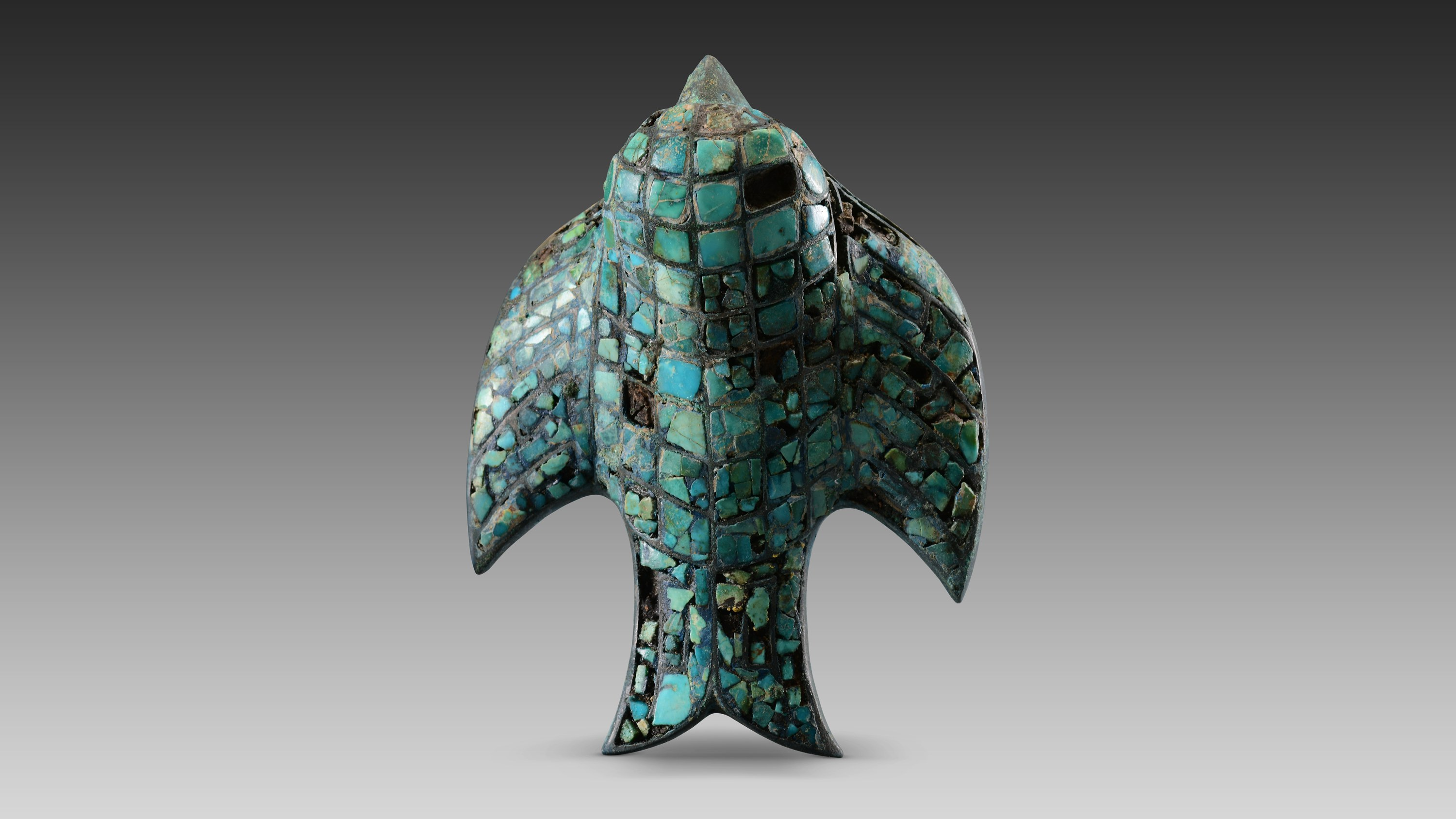 An exquisite turquoise copper bird ornament unearthed from the Zhaigou site in Shaanxi, China. /CNSPhoto