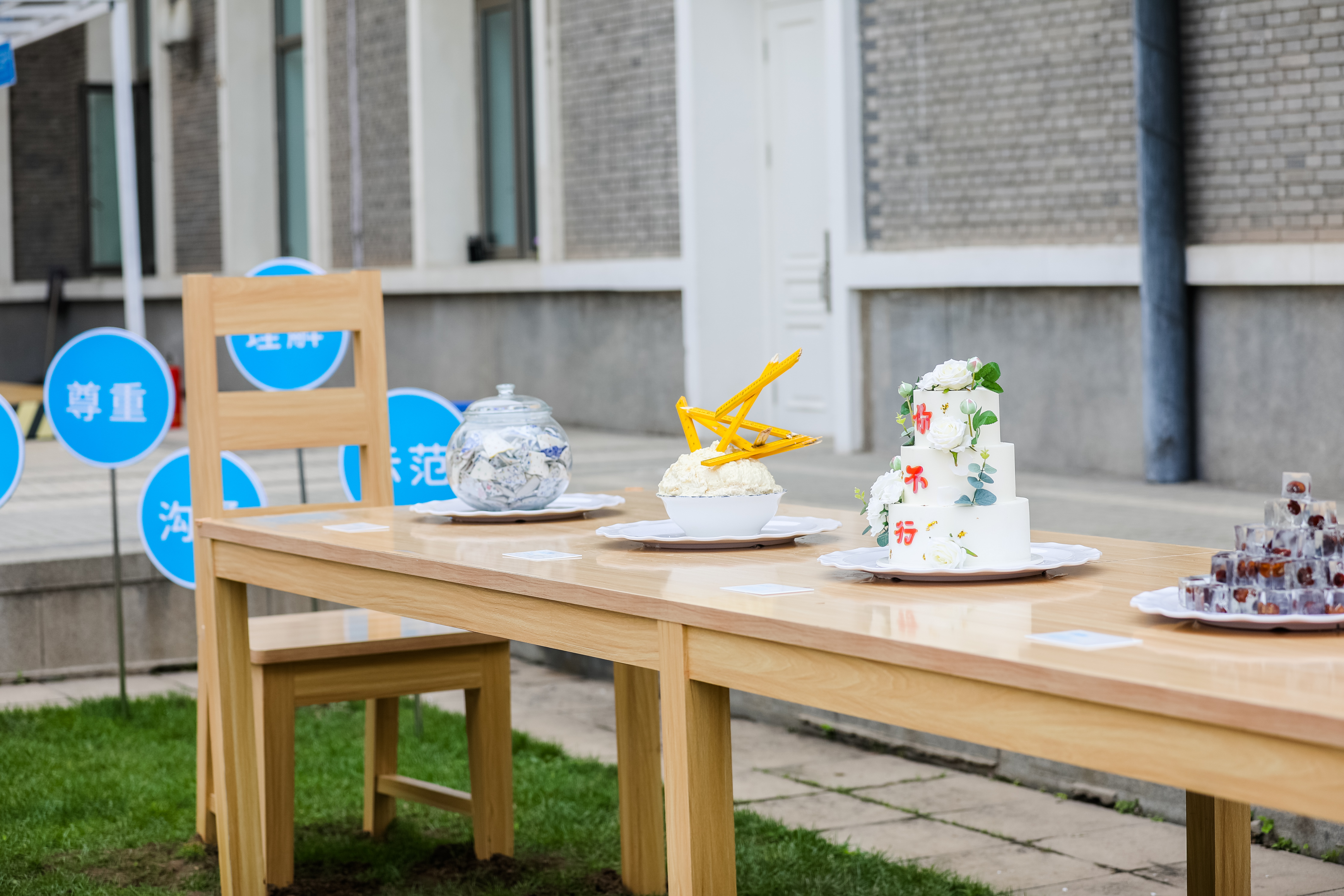 An art installation portraying children's experiences in the home setting is on display at the China National Children's Center in Beijing on May 31, 2023. The dishes displayed on the dining table represent opposition to parents disciplining and criticizing their children during mealtimes and advocate for positive parenting. /UNICEF