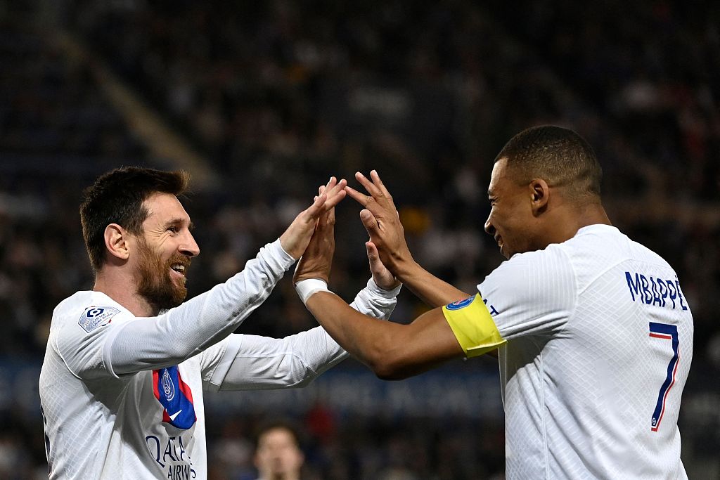 Lionel Messi (L) and Kylian Mbappe of Paris Saint-Germain celebrate after scoring a goal in the Ligue 1 game against Strasbourg Alsace at Stade de la Meinau in Strasbourg, France, May 27, 2023. /CFP