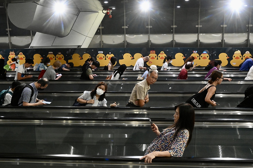 A pair of inflatable giant rubber ducks will be making a splash in Hong Kong's Victoria Harbour from June 10, with artwork based on the beloved sculptures displayed at MTR stations on June 2, 2023. /CFP