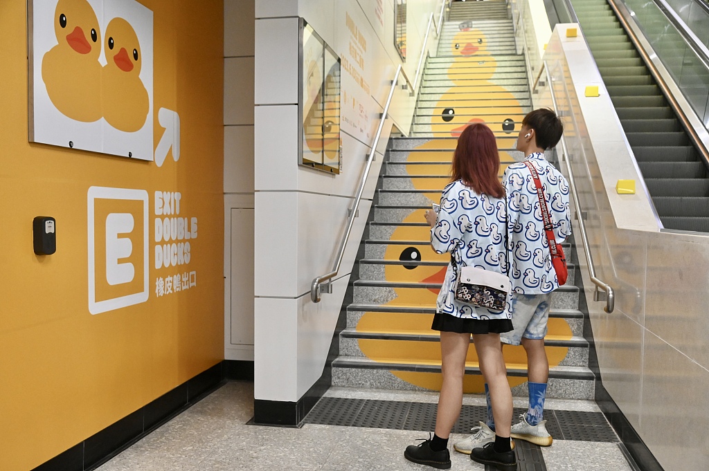 The subway exits of a slew of Hong Kong MTR stations – such as Central, Causeway Bay, and Tsi Sha Tsui – are transformed with rows of cute ducky wallpapers and floor decorations on June 2, 2023. /CFP