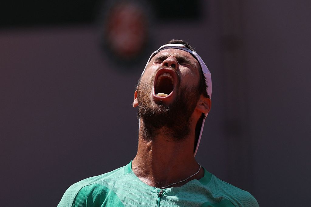 Russia's Karen Khachanov celebrates after winning against Italy's Lorenzo Sonego at the end of their men's singles match on day eight of the French Open at Roland Garros in Paris, France, June 4, 2023. /CFP