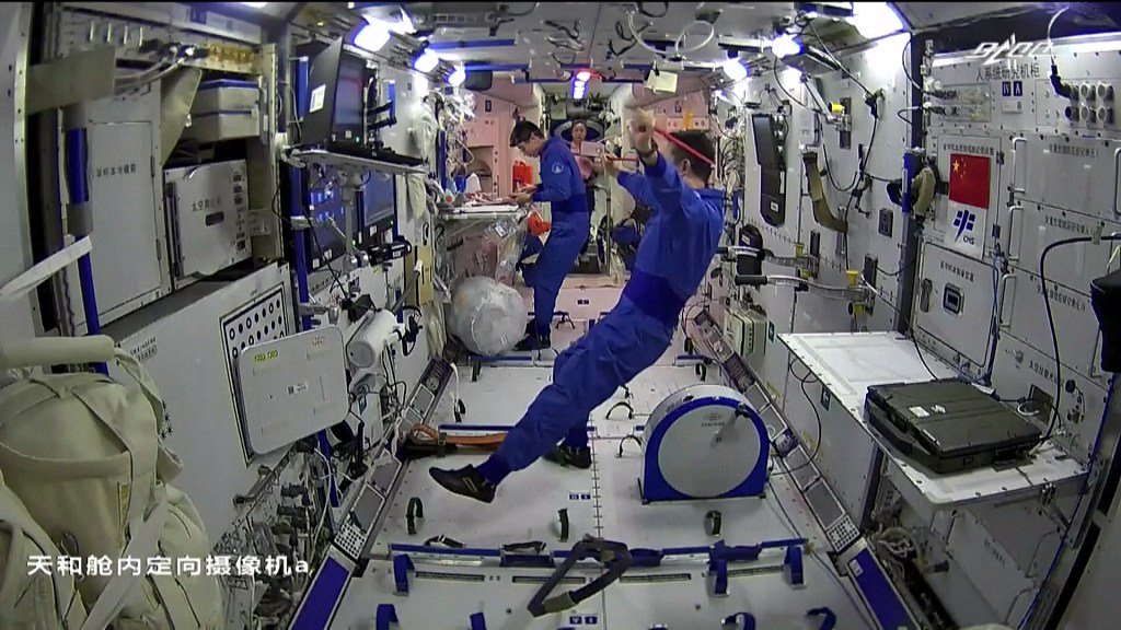 The Shenzhou-13 crew exercise at the space station. /CFP