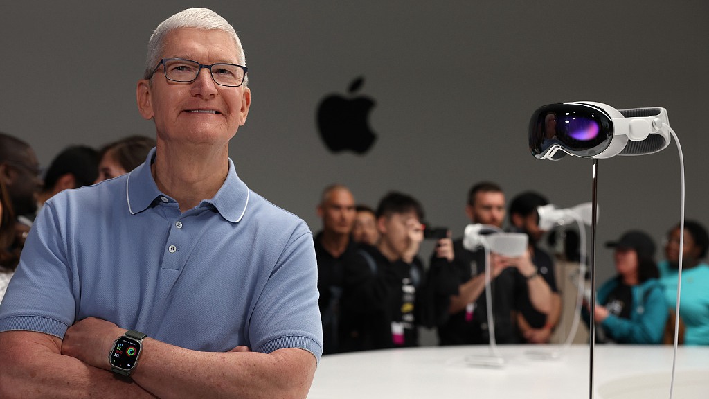 Apple CEO Tim Cook stands next to the new Apple Vision Pro headset. /CFP