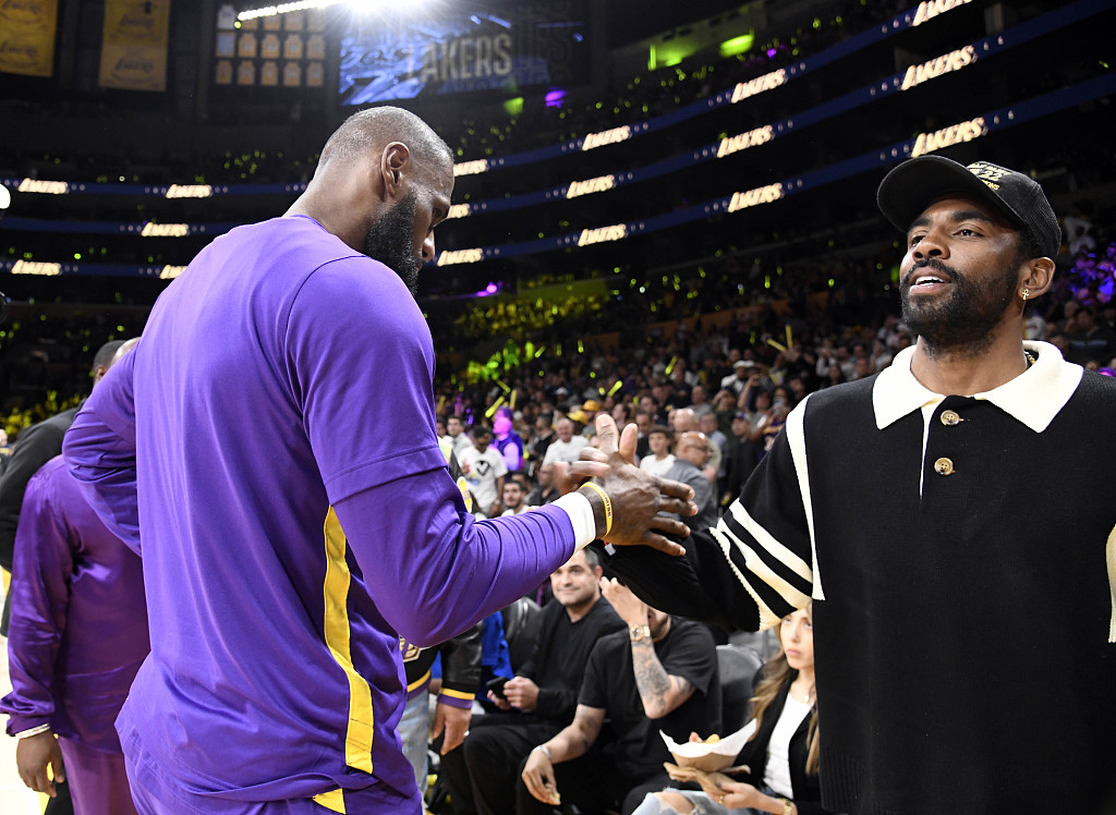 LeBron James (L) of the Los Angeles Lakers and Kyrie Irving of the Dallas Mavericks shake hands during Game 6 of the NBA Western Conference first-round playoffs between the Lakers and the Memphis Grizzlies at Crypto.com Arena in Los Angeles, California, April 28, 2023. /CFP